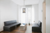 Tubular filament bulb in a pendant in a seating area